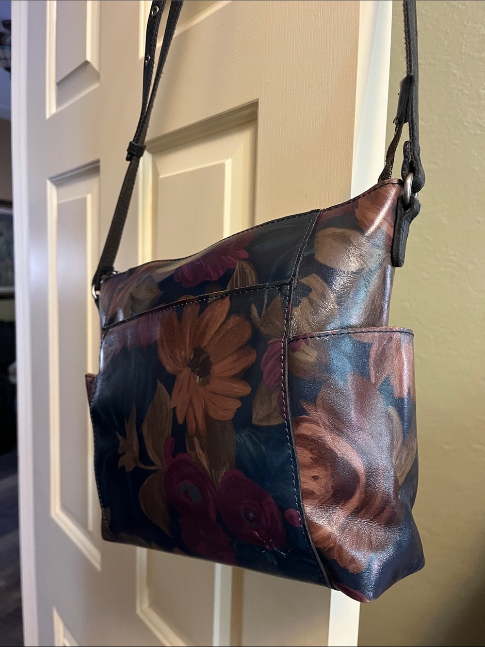 Aveley leather floral crossbody bag w/ dust bag. Inspired by a Peruvian painting